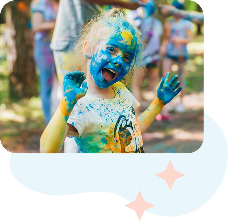 Kid covered in colored powder